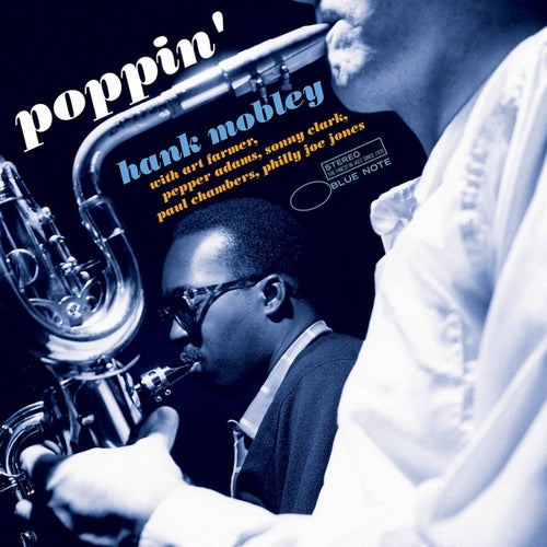 Vinyl LP van Hank Mobley met de albumhoes voor "Poppin'" met jazzmuziek en artwork op de voorkant.