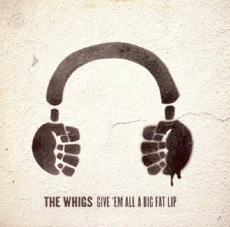 CD van de band Whigs, "Give 'em all a big fat lie", met albumhoes en artwork zichtbaar.
