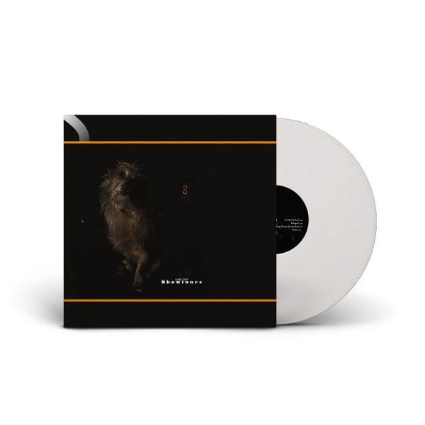 Lambchop Showtunes LP met kleurrijk albumhoes, zwart-wit afbeelding met bandnaam en titel op vinylplaat.