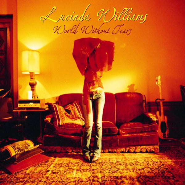 Vinyl LP van Lucinda Williams getiteld "World without Tears" met albumhoes en zwarte platenspeler.