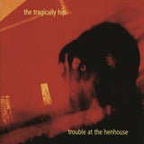 CD van Tragically Hip met album Trouble at the Henhouse, kleurrijk albumhoes met bandfoto en titel in zwart-wit.